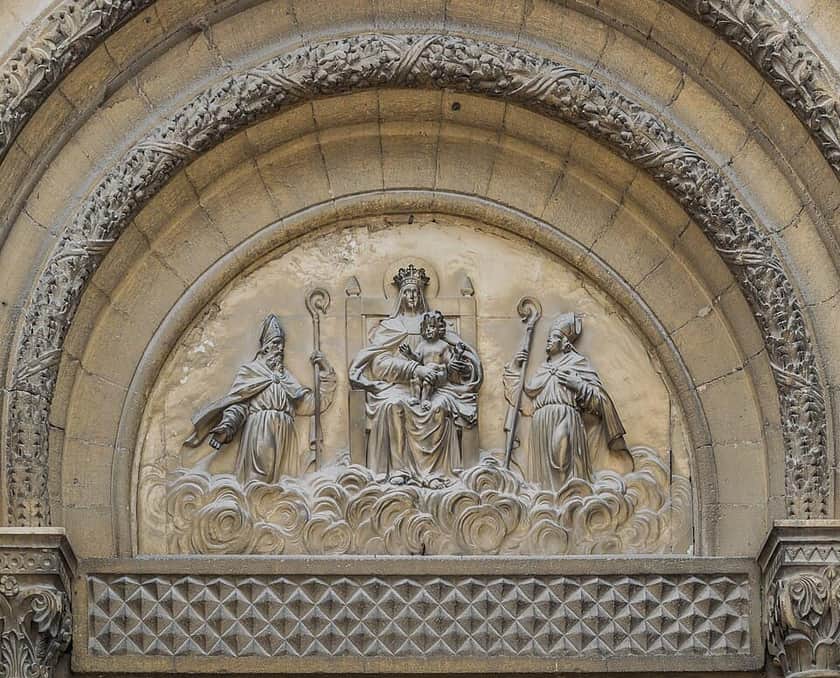 Saints Firmin and Ferréol of Uzès beside the Virgin and Child on the cathedral tympanum