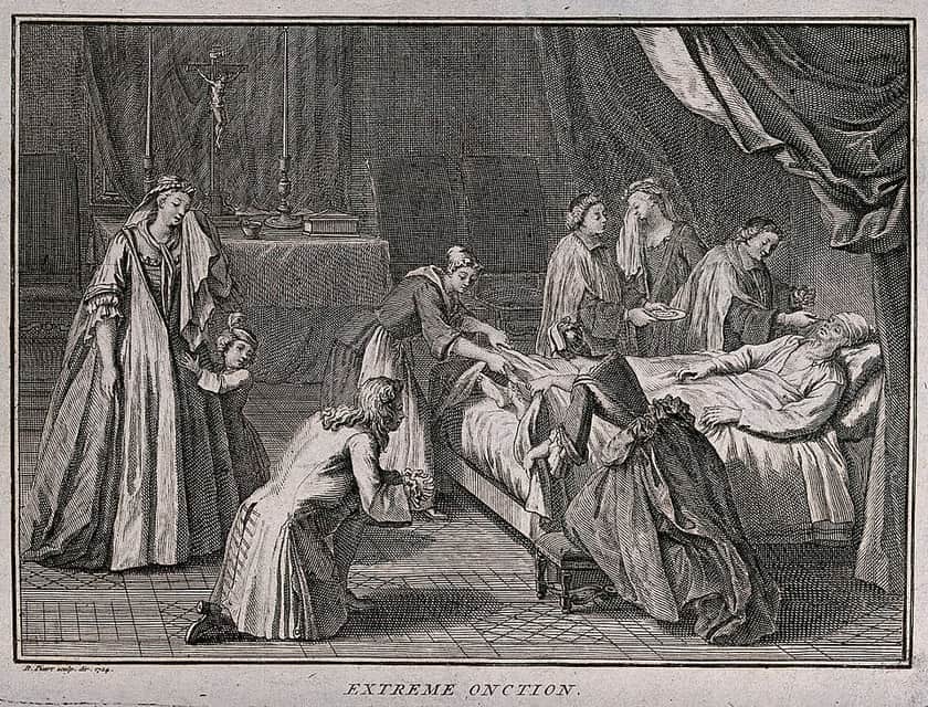 A priest administering the Anointing of the Sick